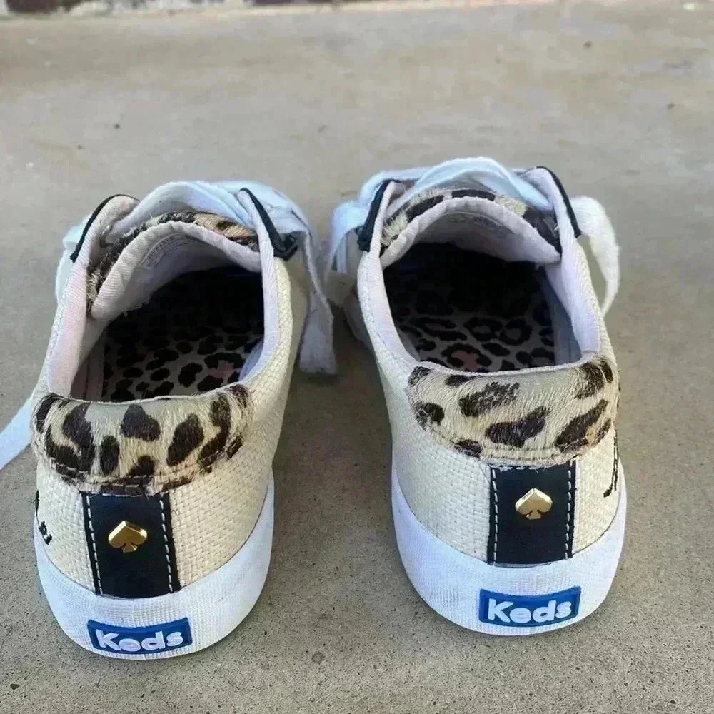 Keds beige canvas sneakers with black trim and leopard heel
